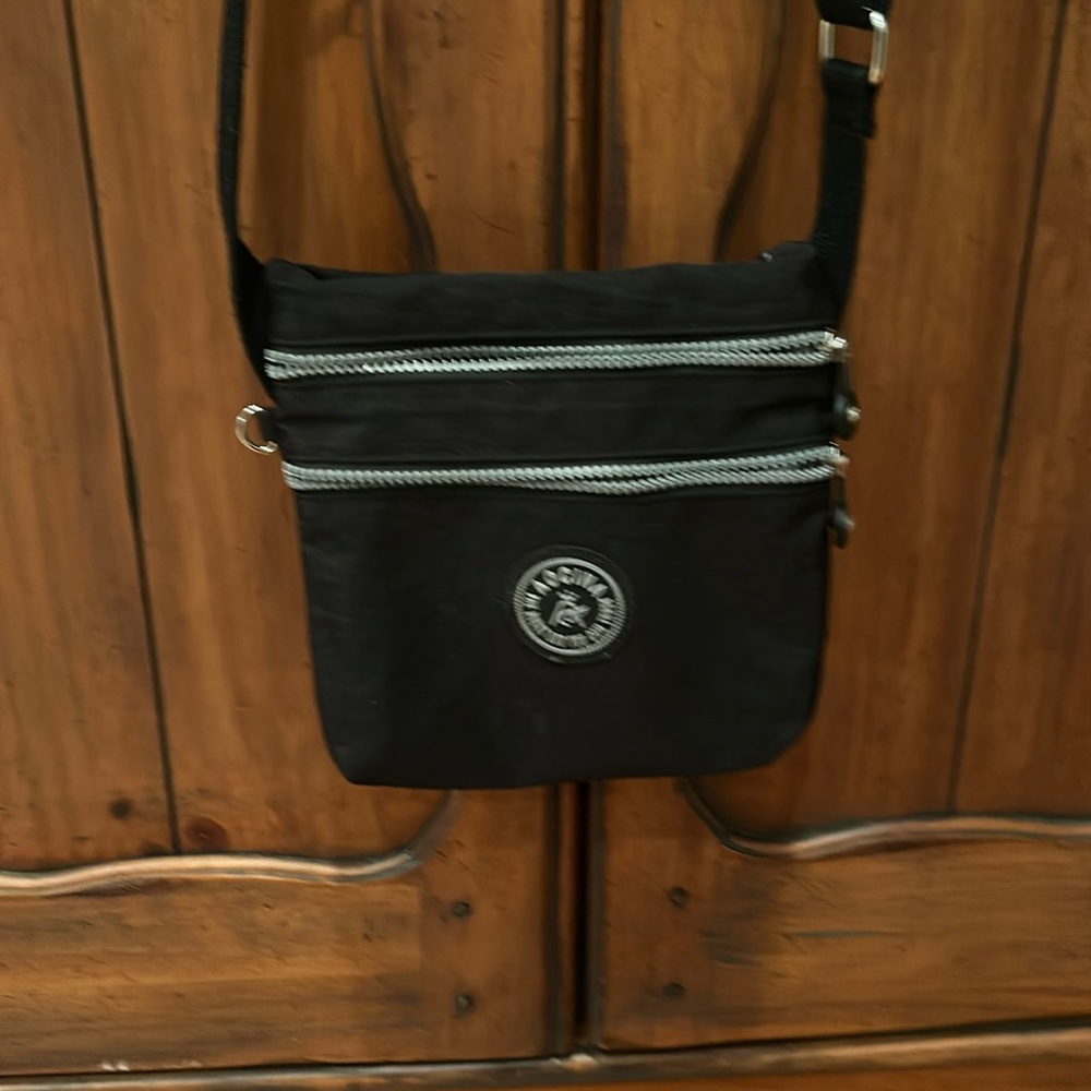 Aocina lightweight black bag with silver zippers. Crossbody.